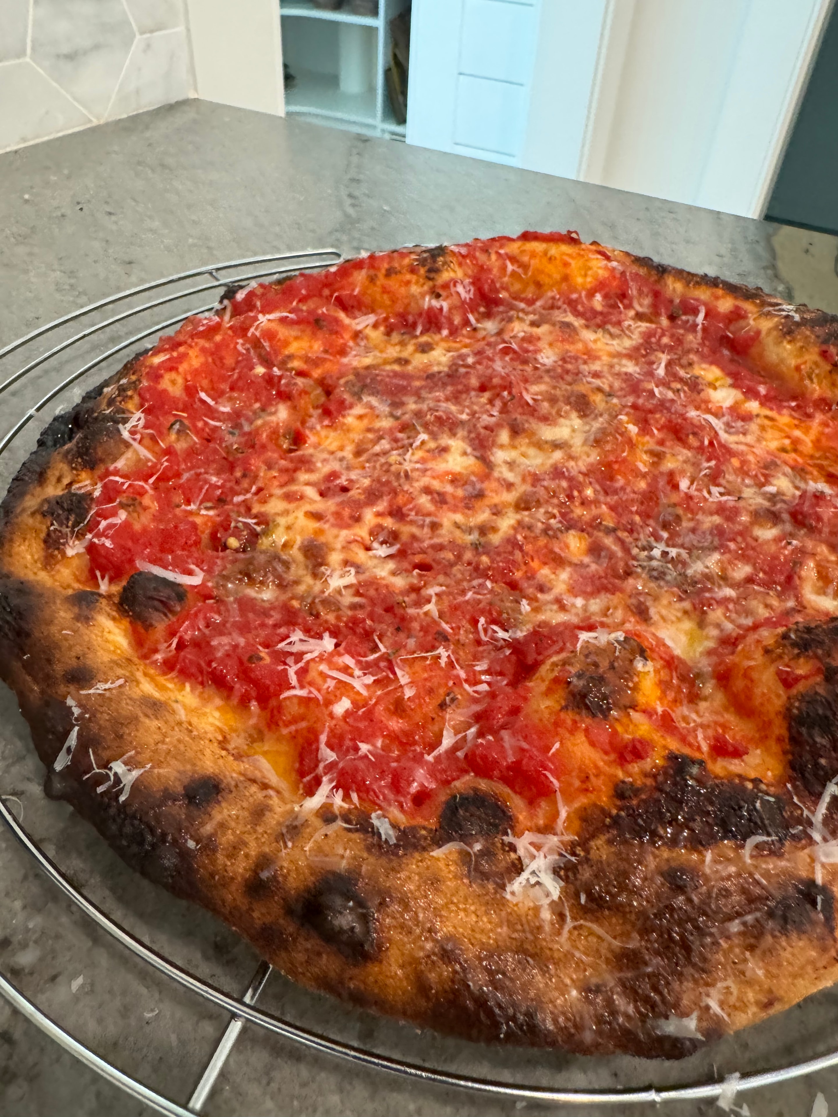 Greg's tomato and cheese pizza with charred crust