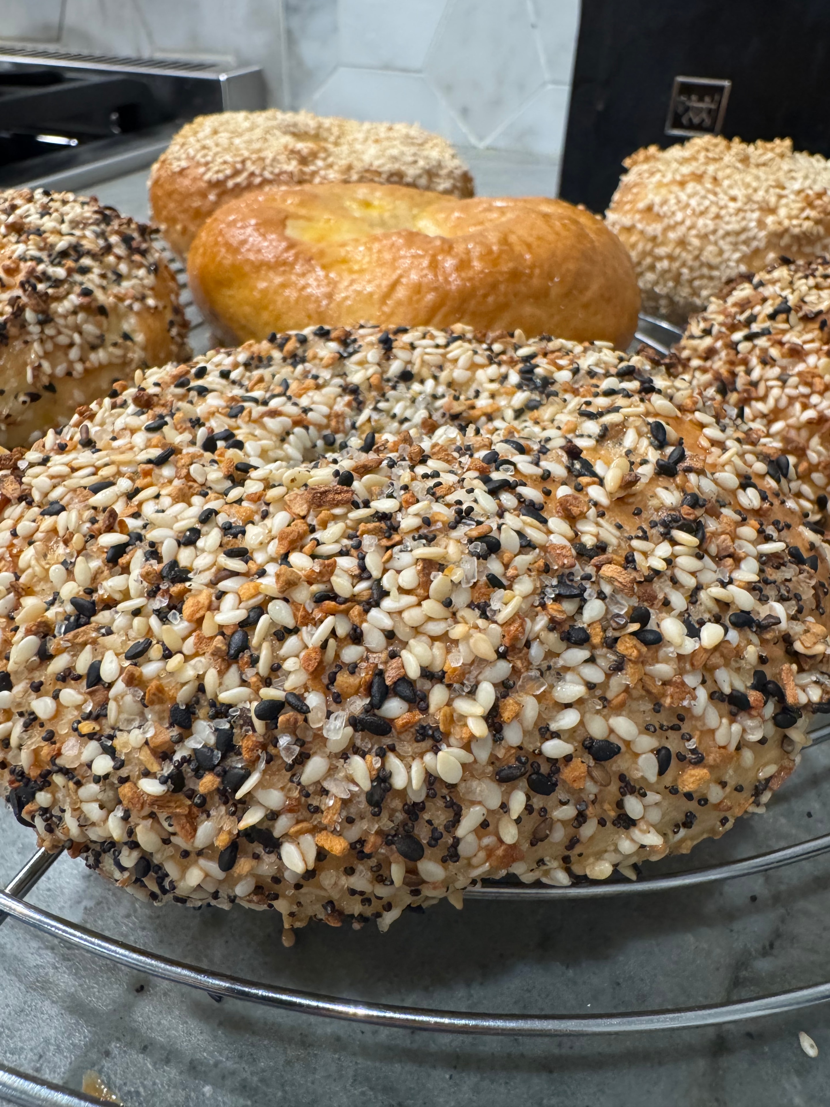 Fresh bagels on rack