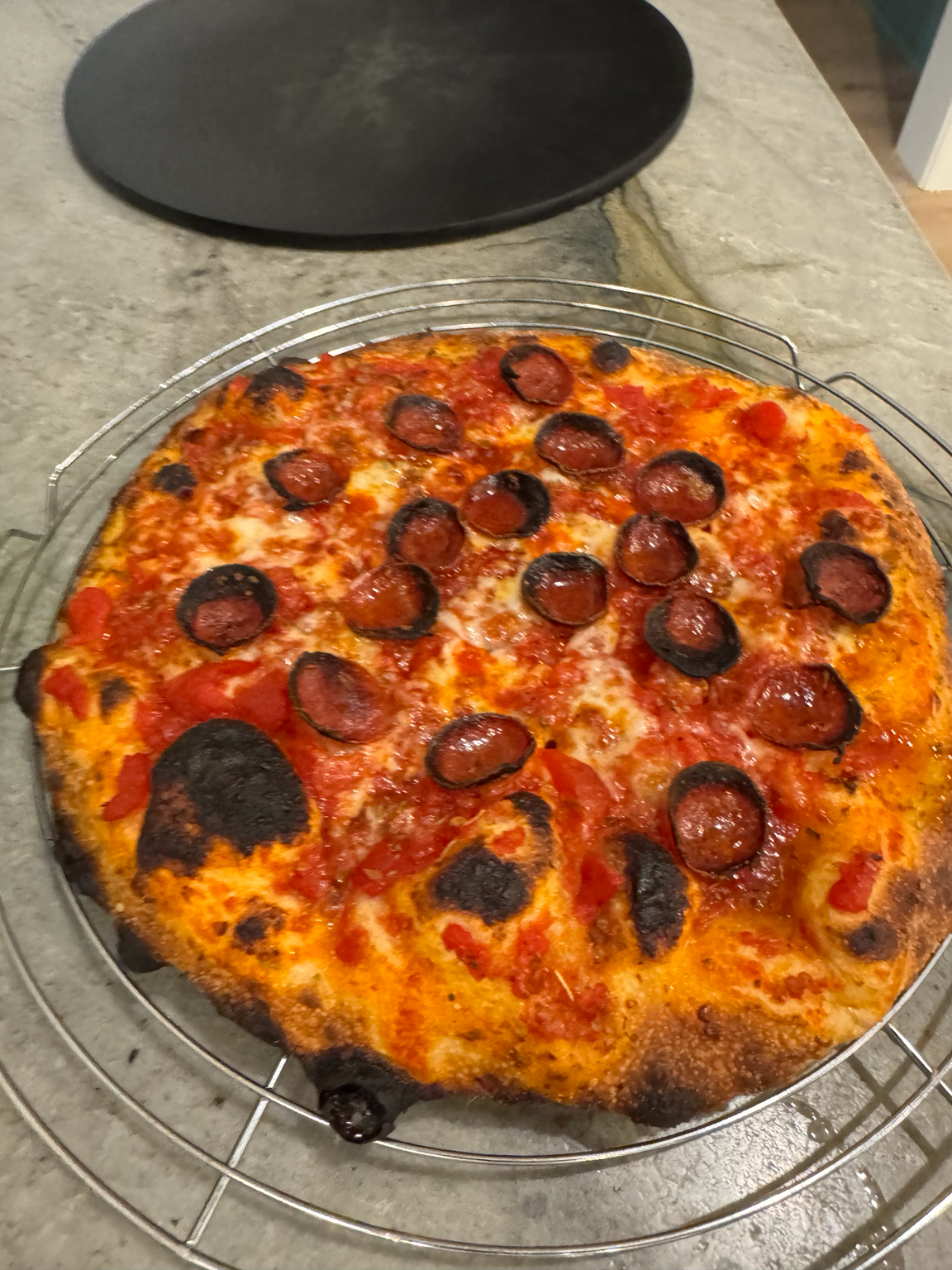 Greg's pepperoni pizza on cooling rack